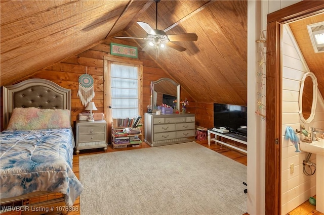 bedroom featuring ceiling fan, wood ceiling, and vaulted ceiling