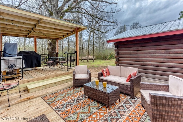 deck featuring grilling area and an outdoor living space