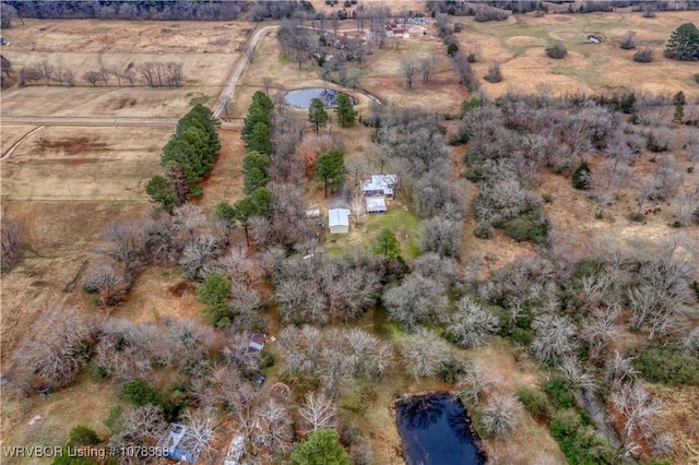 aerial view with a rural view and a water view