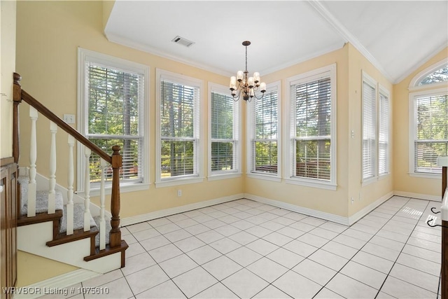 unfurnished sunroom with vaulted ceiling and an inviting chandelier