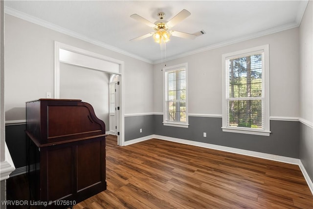 interior space featuring hardwood / wood-style floors, ceiling fan, and crown molding