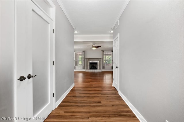 corridor featuring dark hardwood / wood-style floors and ornamental molding