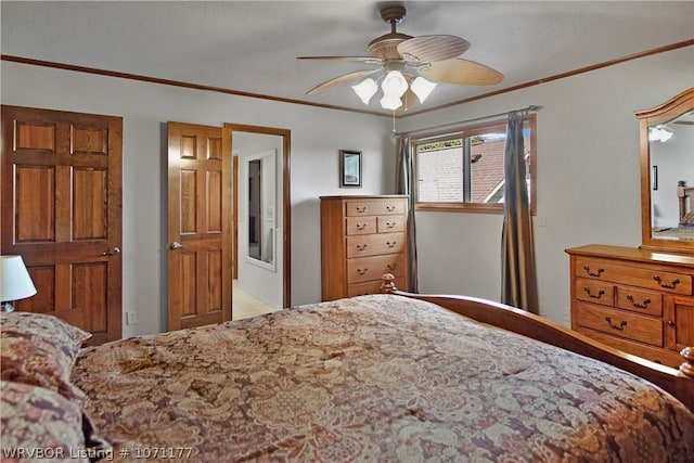 bedroom with ornamental molding and ceiling fan