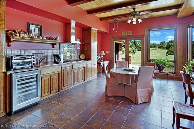 interior space with wooden ceiling, wet bar, beamed ceiling, ceiling fan, and beverage cooler