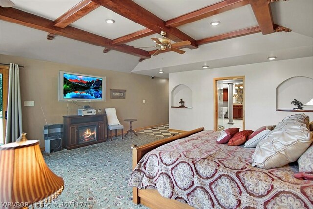 bedroom featuring lofted ceiling with beams, carpet, connected bathroom, and ceiling fan