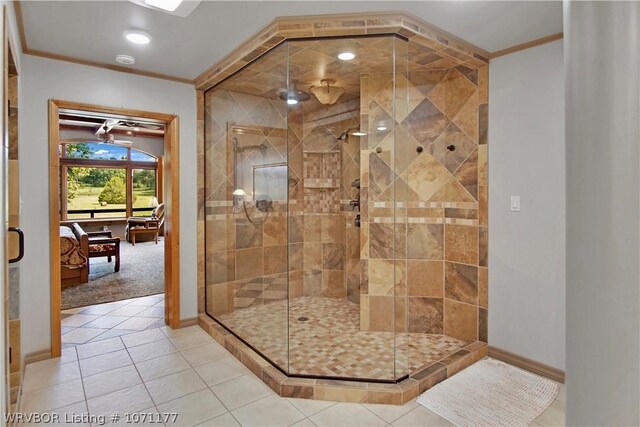 bathroom featuring tile patterned floors, ornamental molding, and walk in shower