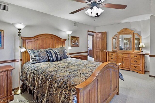 carpeted bedroom with ceiling fan