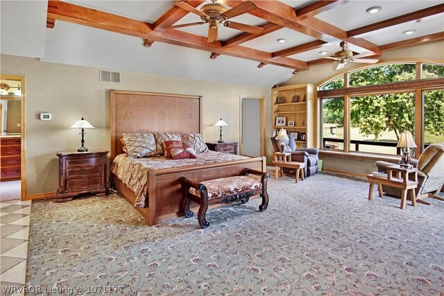 bedroom featuring lofted ceiling with beams