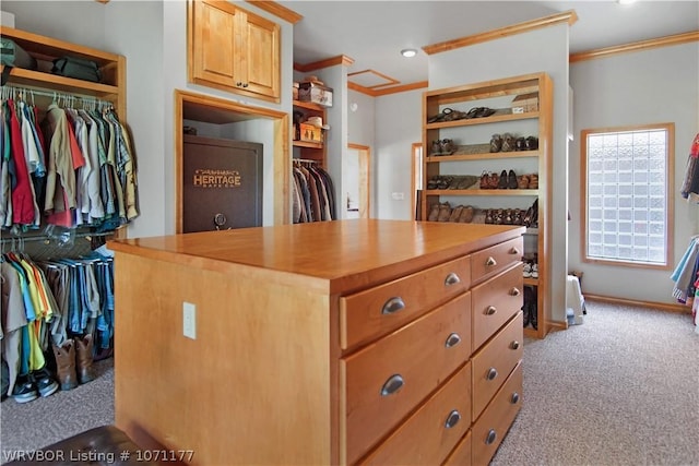 walk in closet featuring light carpet