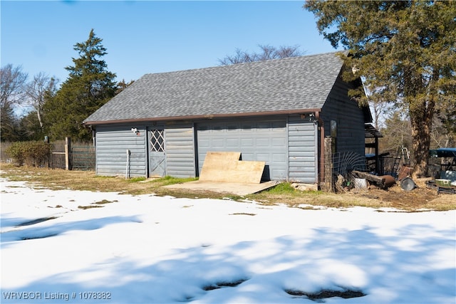 view of snow covered garage