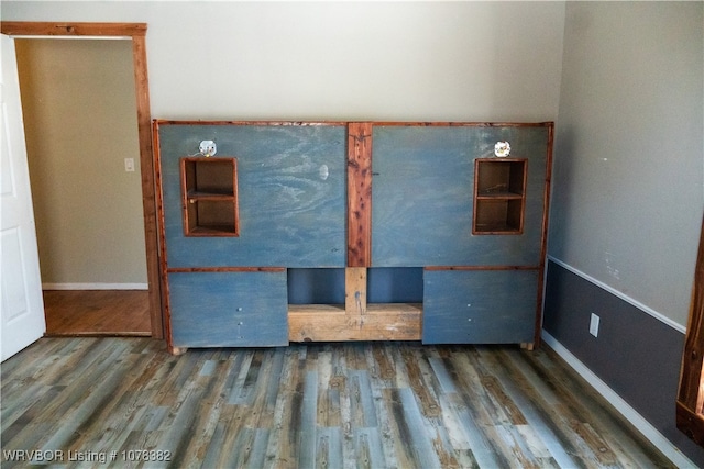 empty room featuring dark hardwood / wood-style flooring