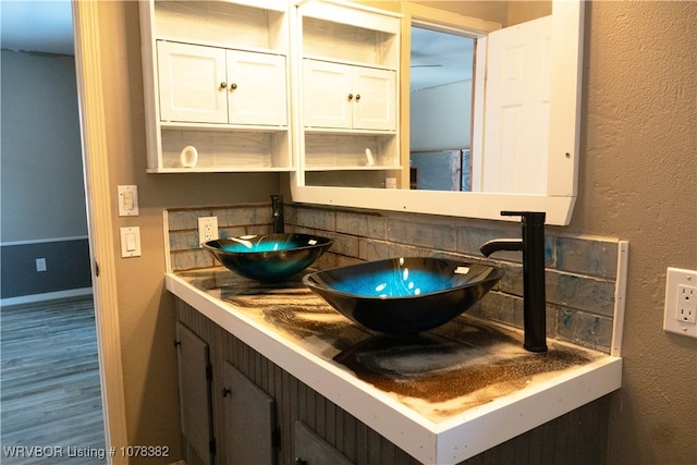 bathroom featuring vanity and hardwood / wood-style flooring