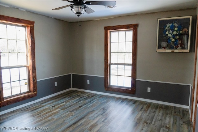 empty room featuring ceiling fan and wood-type flooring