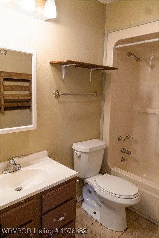 full bathroom with toilet, washtub / shower combination, tile patterned floors, and vanity