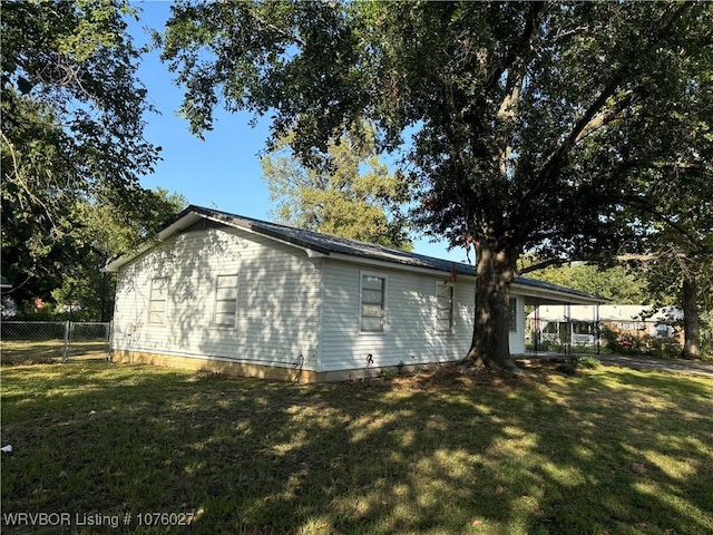 view of home's exterior with a yard