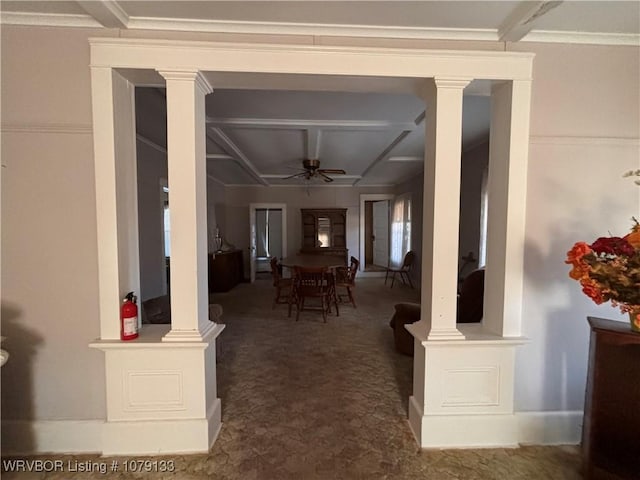 dining space featuring a ceiling fan, beam ceiling, dark carpet, and ornate columns