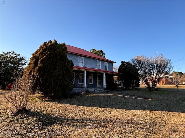 back of house featuring covered porch