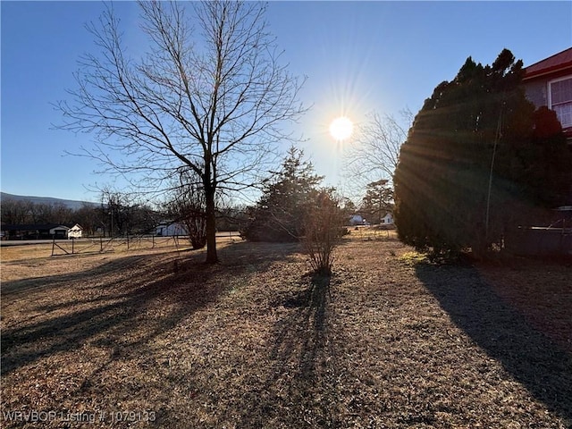 view of yard with a rural view