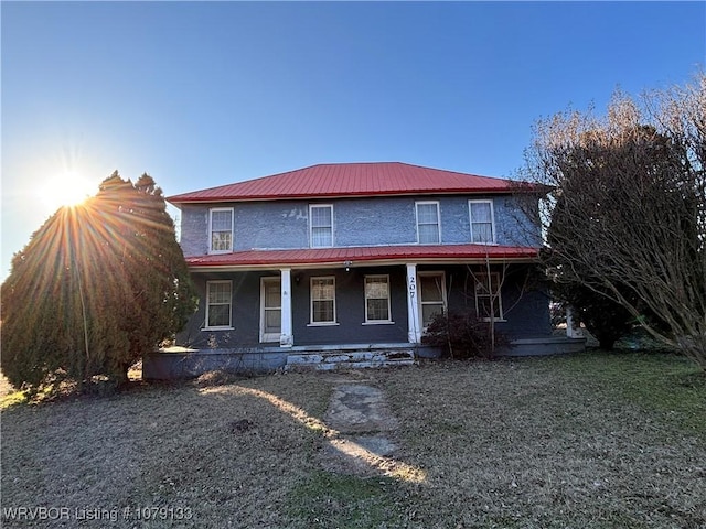 view of front of property with a front lawn and a porch