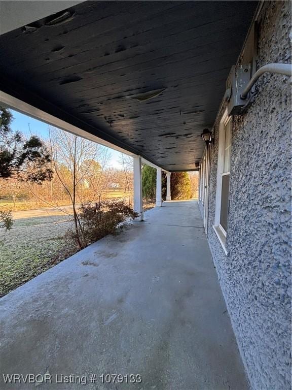 view of patio / terrace featuring a carport