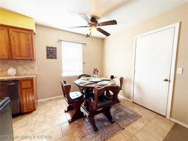 tiled dining area with ceiling fan