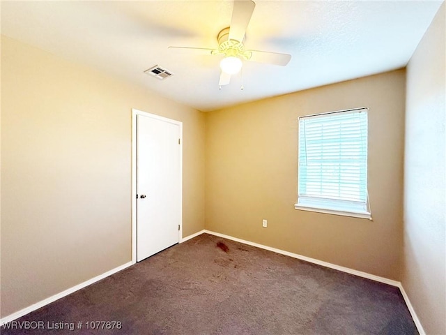 unfurnished room with carpet floors and ceiling fan