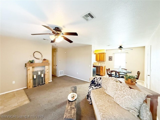 living room with carpet flooring and ceiling fan