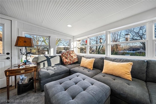 sunroom / solarium featuring a wealth of natural light and vaulted ceiling