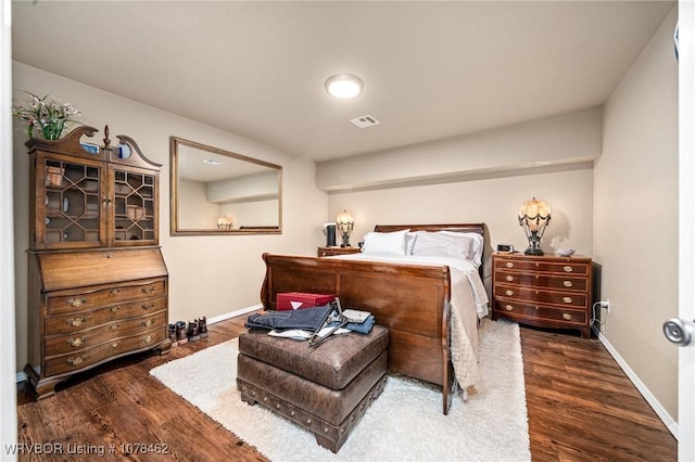 bedroom featuring dark hardwood / wood-style floors