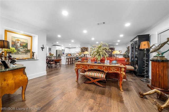 dining space featuring crown molding and dark hardwood / wood-style floors