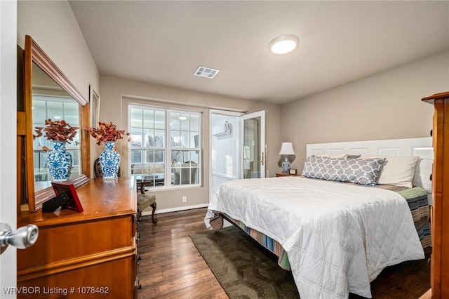 bedroom with dark wood-type flooring