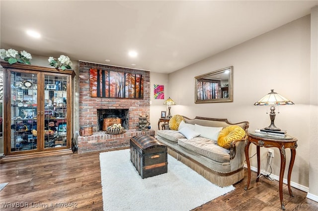 living room featuring hardwood / wood-style floors and a fireplace