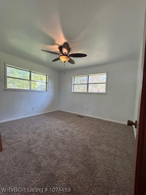 empty room with carpet and ceiling fan