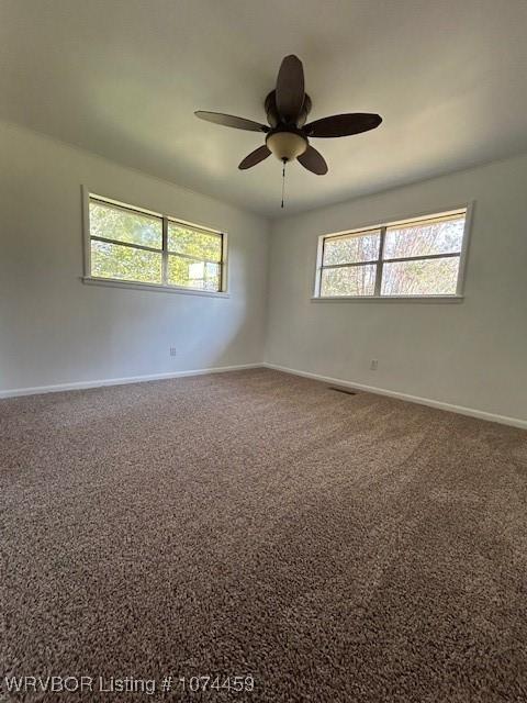 empty room with carpet flooring and ceiling fan