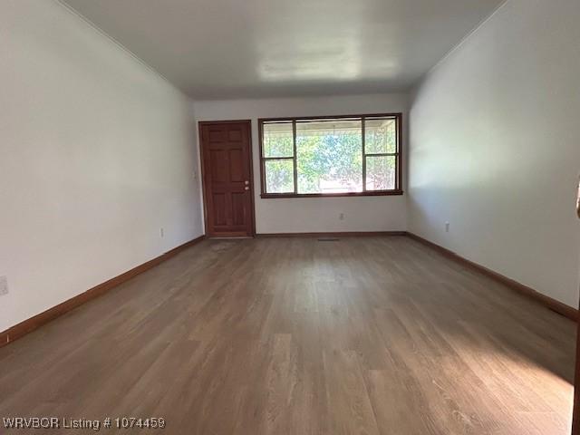 unfurnished room featuring hardwood / wood-style floors