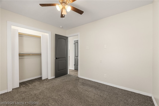 unfurnished bedroom with a closet, baseboards, and carpet floors