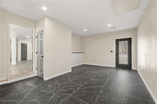 empty room featuring visible vents, baseboards, attic access, recessed lighting, and marble finish floor