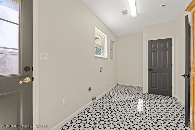 foyer with visible vents, light floors, and baseboards