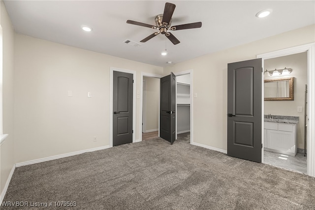 unfurnished bedroom featuring recessed lighting, visible vents, baseboards, and carpet