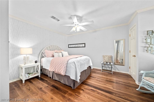 bedroom with dark hardwood / wood-style flooring, crown molding, and ceiling fan