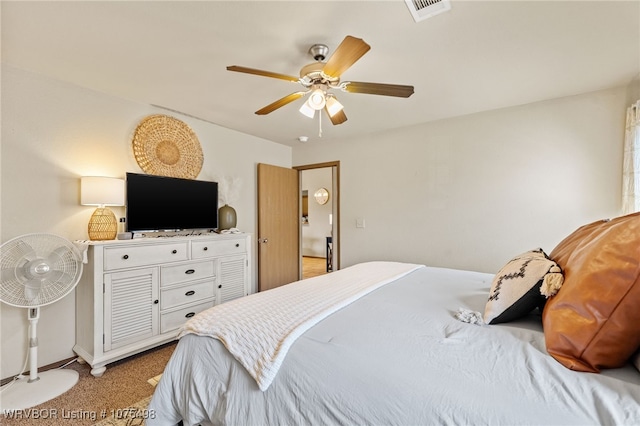 bedroom featuring ceiling fan and light carpet