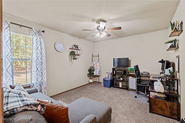 carpeted home office with ceiling fan