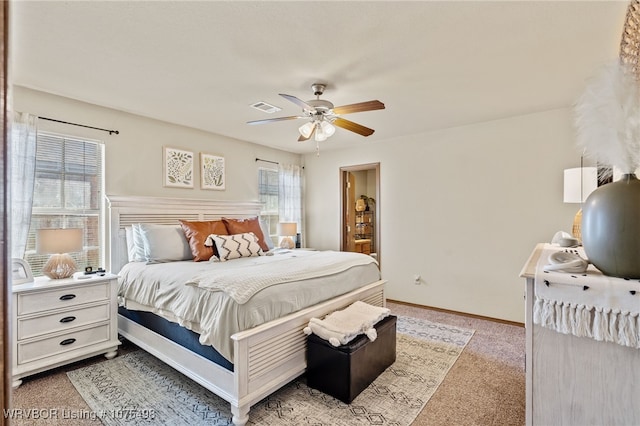 bedroom featuring ceiling fan and light colored carpet