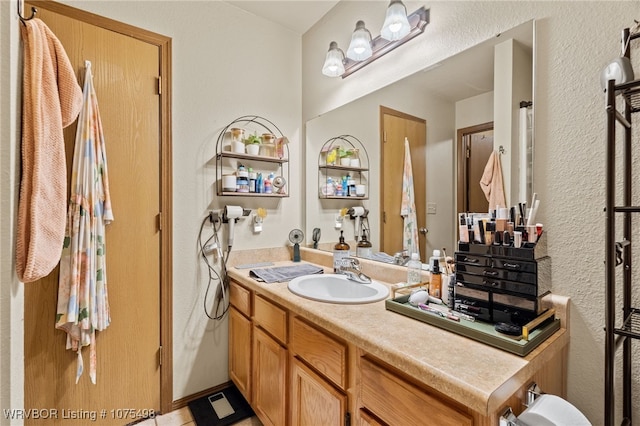 bathroom featuring tile patterned floors and vanity