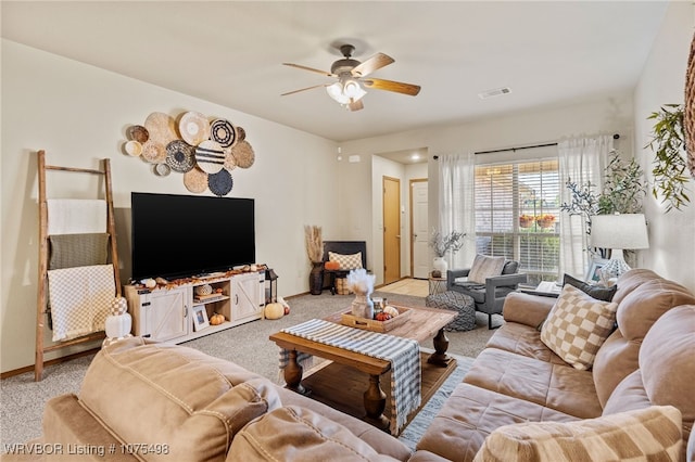 carpeted living room featuring ceiling fan