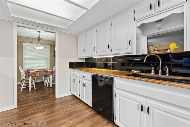 8611 Royal Ridge Dr, Fort Smith, AR 72903 - kitchen with dishwasher, white cabinets, dark wood-style flooring, decorative backsplash, and hanging light fixtures