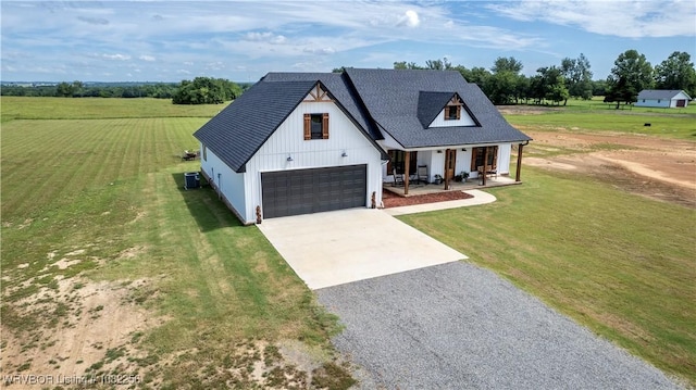 16312 Castle Rd, Poteau, OK 74953 - modern farmhouse style home with concrete driveway, covered porch, a front yard, and a garage