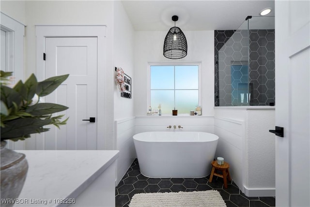 16312 Castle Rd, Poteau, OK 74953 - bathroom featuring a freestanding tub and tile patterned floors