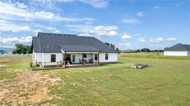 16312 Castle Rd, Poteau, OK 74953 - rear view of property with a patio, a lawn, and a shingled roof