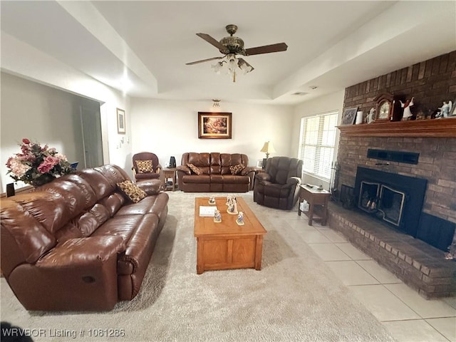 2103 W George, Pocola, OK 74902 - living room with light tile patterned floors, ceiling fan, a brick fireplace, and a tray ceiling
